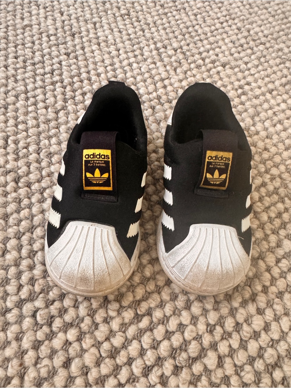 adidas Kids Black & White Slip-On Shell Toe Sneakers with Gold Logo Tab